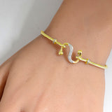 <span>DIAMOND CLOSEOUT! </span>.10ct G SI 14K Yellow Gold Diamond Wrap around Hook Bangle Bracelet 7" Long