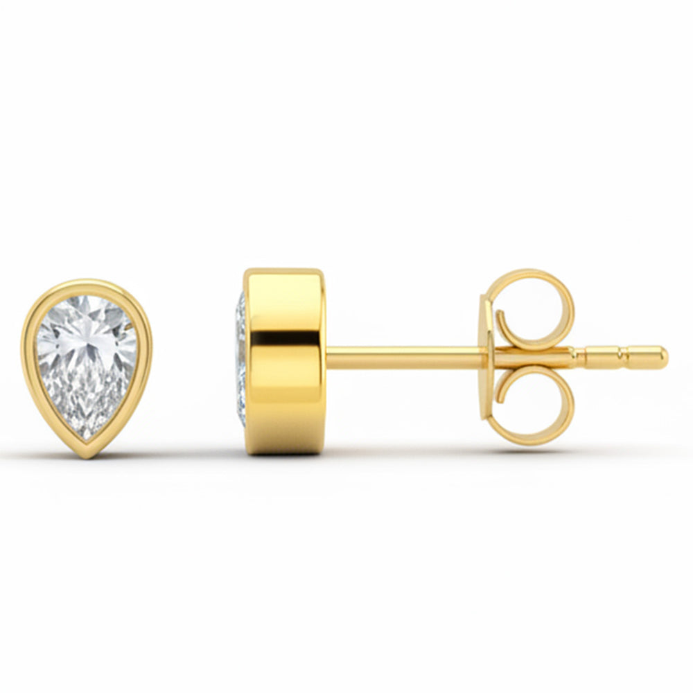 <span style="color:purple">¡ESPECIAL!</span> Aretes de oro amarillo de 14kt con diamantes de talla pera de .32ct G SI y engaste de bisel